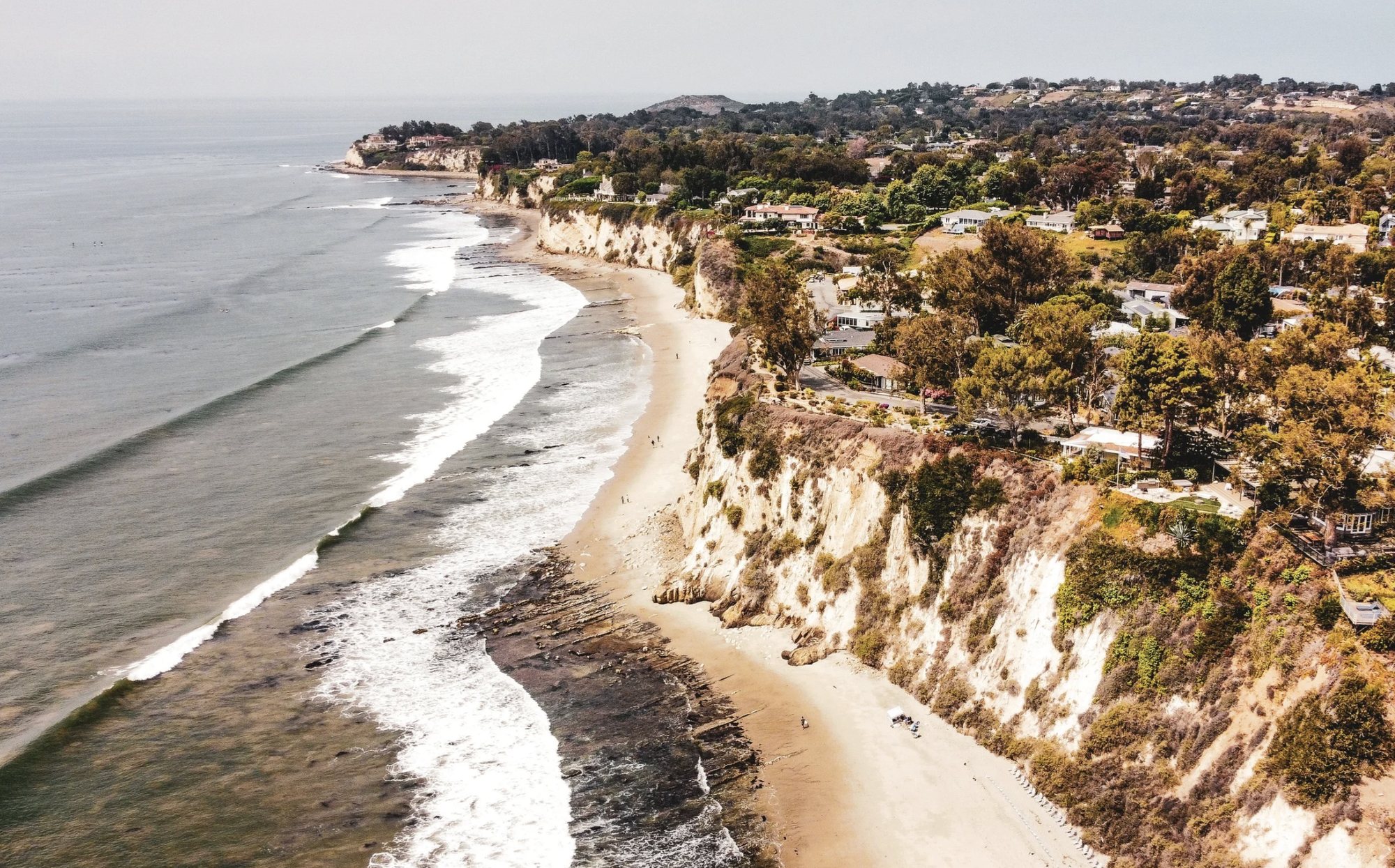 Aerial view of coastal bluff residences along the Malibu shoreline